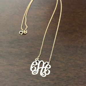 CAC monogram gold necklace